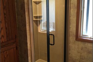 Replacement shower project with semi frame-less hinged shower door in Minneapolis, MN